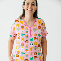 Close up image of a woman wearing Pink Party Pals women's short sleeve pj top