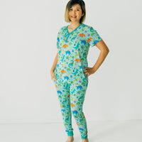 Woman wearing a Prehistoric Party women's short sleeve pj top and matching women's pj pants