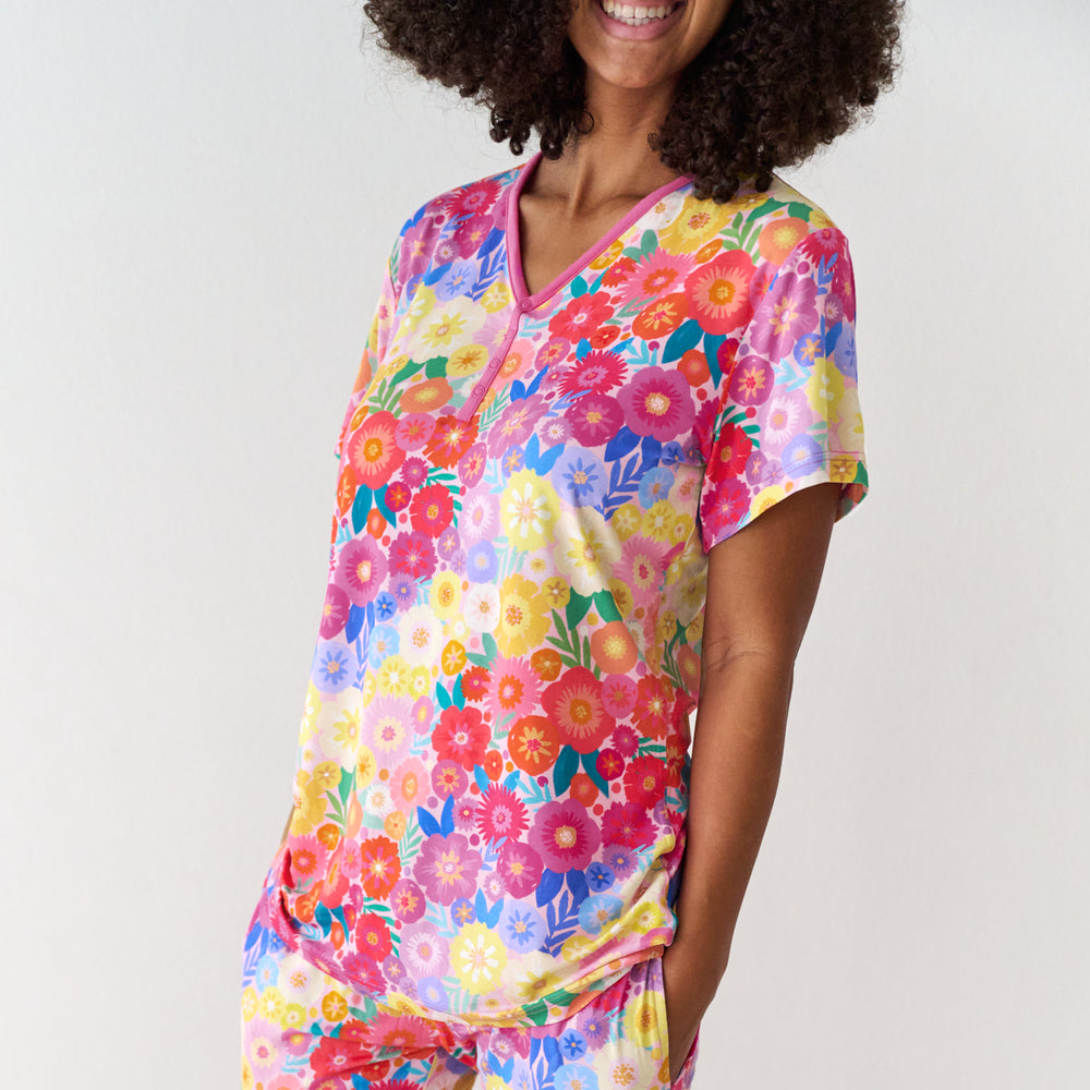 Alternate close up image of a woman wearing Rainbow Blooms women's short sleeve pajama top and matching pajama pants