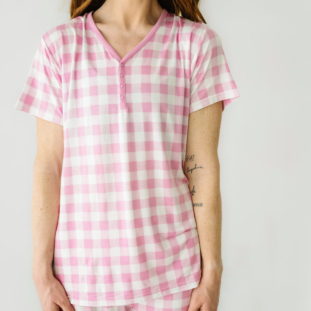 Click to see full screen - Close up image of a woman wearing a Pink Gingham women's pajama top