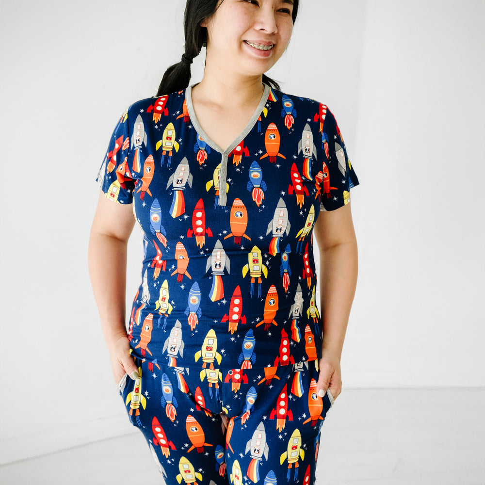 Close up image of a woman wearing a Navy Space Explorer women's short sleeve pajama top
