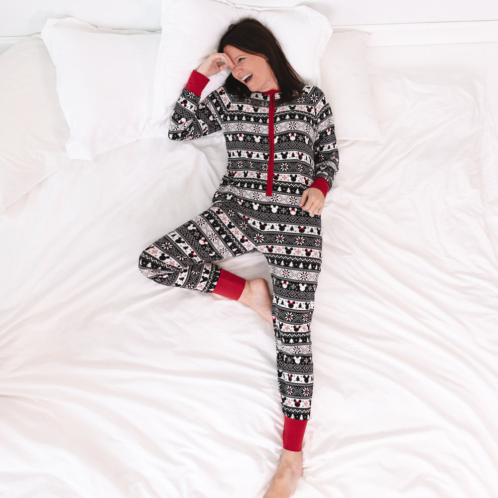 woman laying on a bed wearing a women's Mickey Fair Isle adult zippy