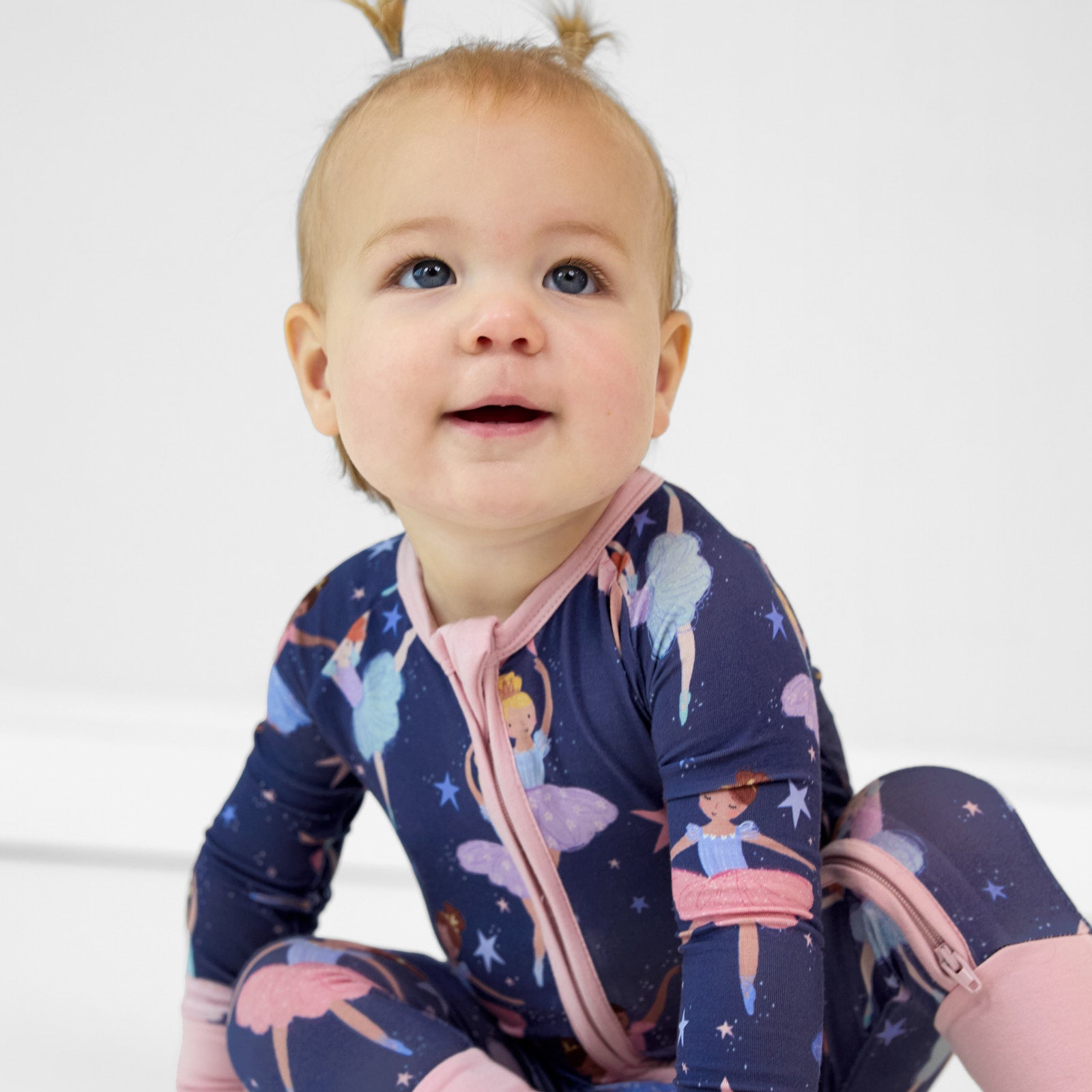 close up image of a child sitting wearing a Twilight Ballet zippy