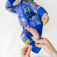 Close Up Of Baby's Feet Wearing Birthday Builder Zippy