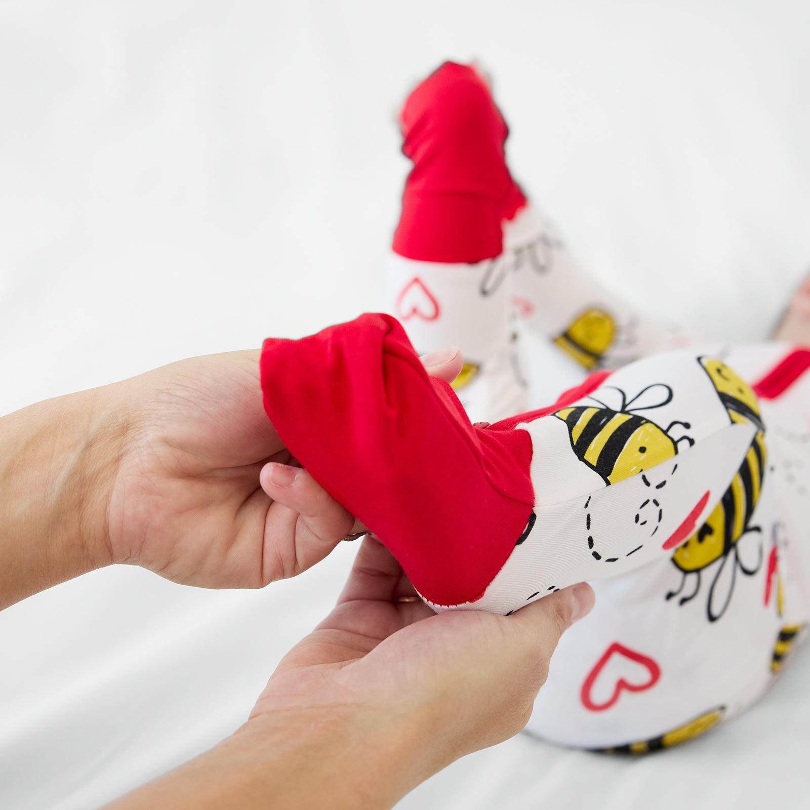 Close up image of the fold over feet cuffs on a Bee Mine zippy