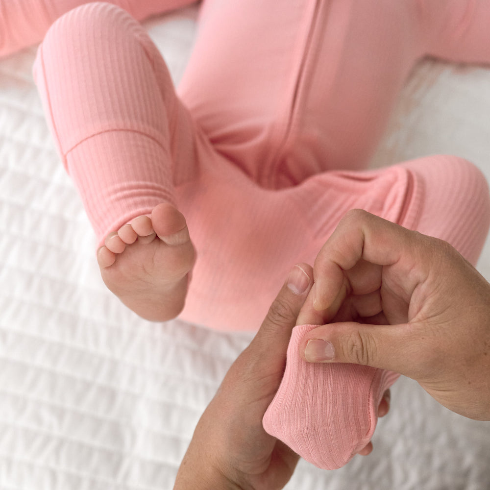 Close up image of the fold over foot detail on the Bubblegum Ribbed Zippy