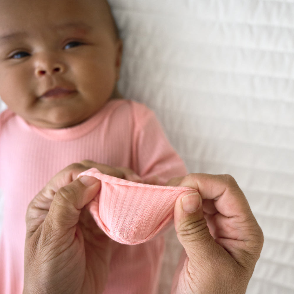 Close up image of fold over hand detail on the Bubblegum Ribbed Zippy