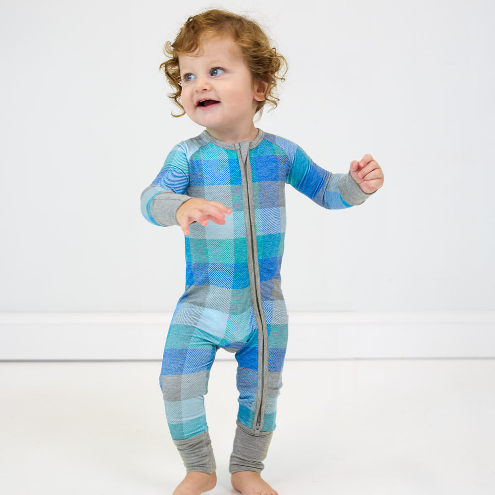 child walking wearing an Arctic Plaid zippy