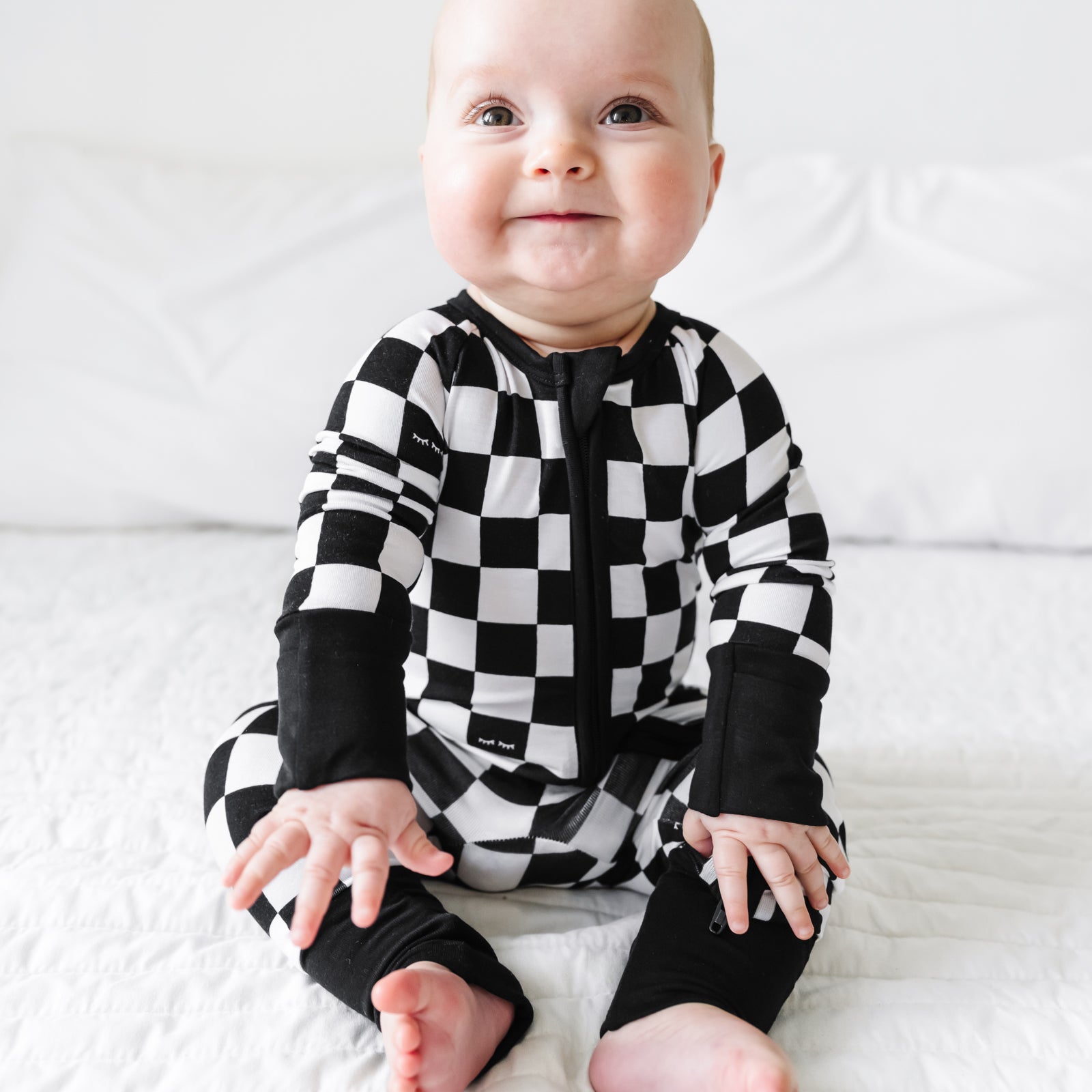 child sitting wearing a Cool Checks zippy
