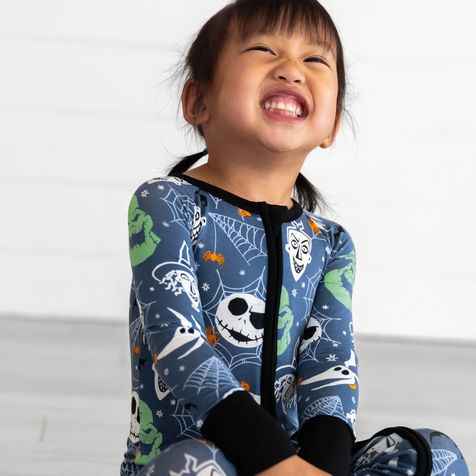 Girl smiling while wearing the Disney Jack & Crew Zippy