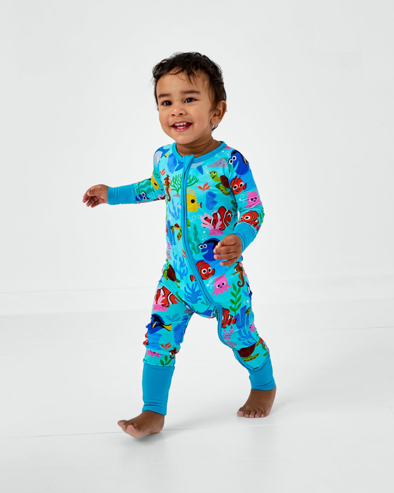Running toddler wearing the Pixar Nemo's Reef Zippy