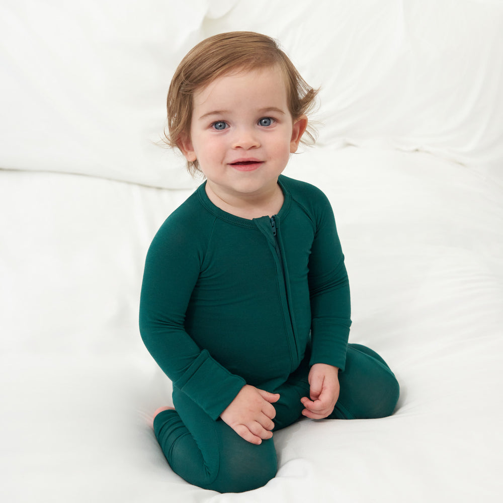 Alternative image of baby kneeling on white bed while wearing the Emerald Zippy