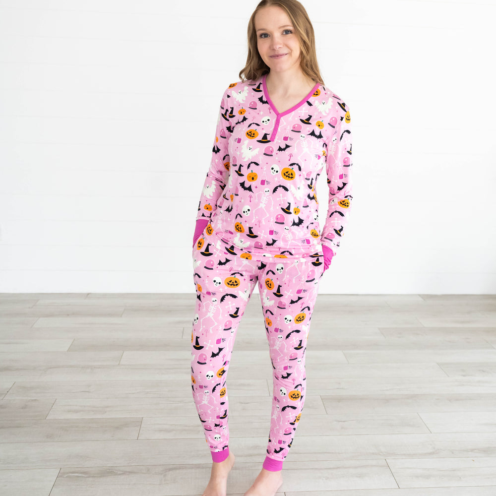 Female model wearing the Pink Glowing Ghouls Women's Pajama Top & Pants