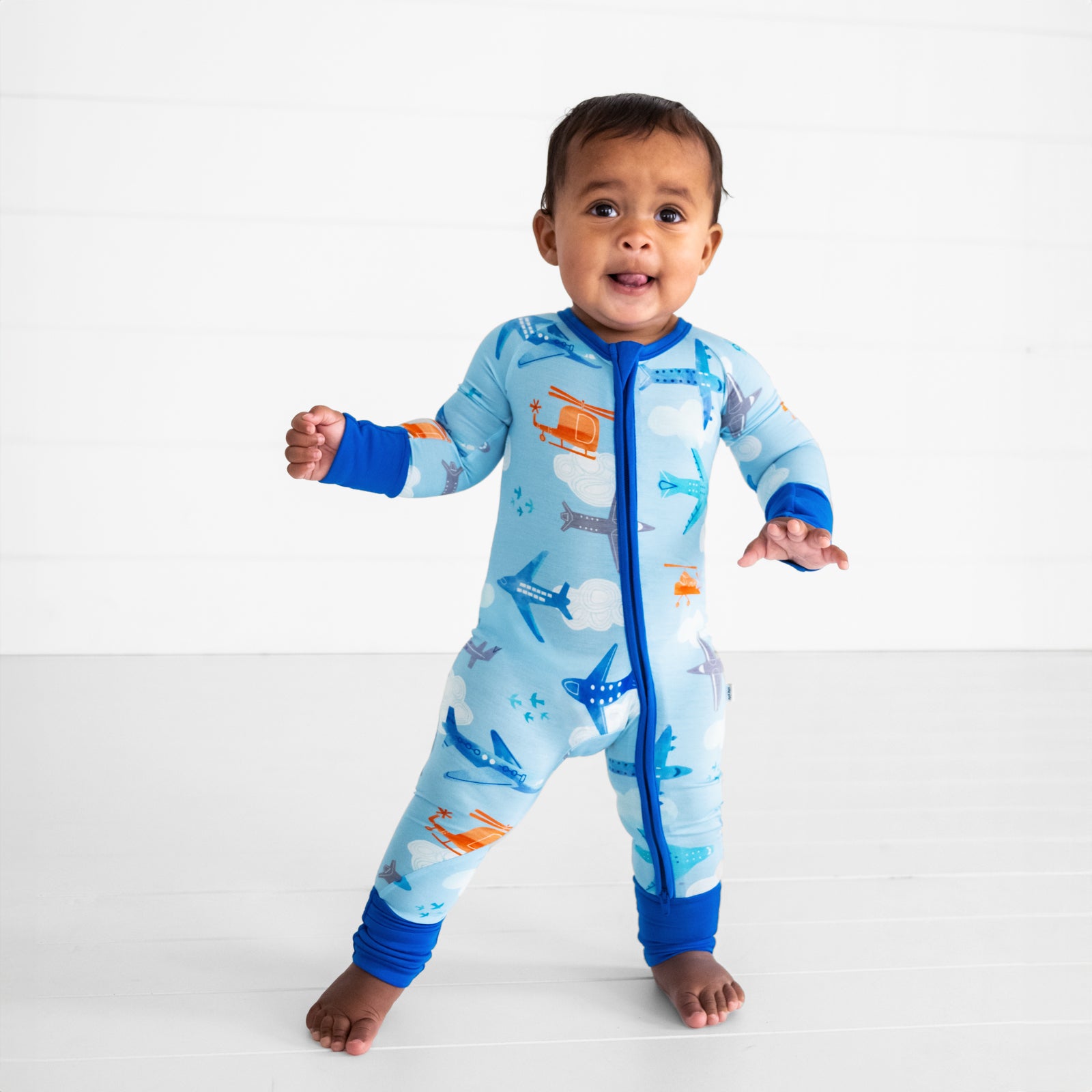 image of a child wearing a Let's Fly zippy