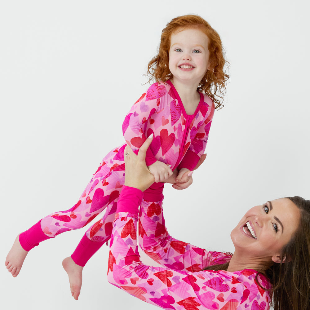 Mommy and me matching in Pink Hearts & Crafts pajamas.