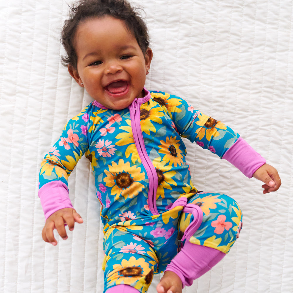 Top view image of baby laying down while in the Sunflower Fields Zippy