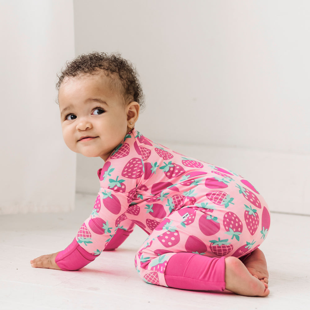 Baby crawling while wearing the Sweet Strawberries Zippy