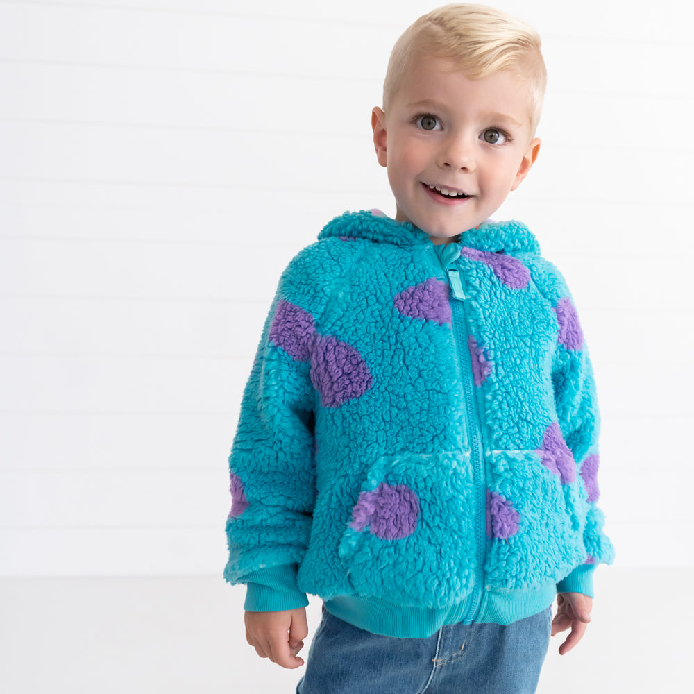 Smiling boy wearing the Disney Monsters, Inc. Sulley Sherpa Zip Hoodie