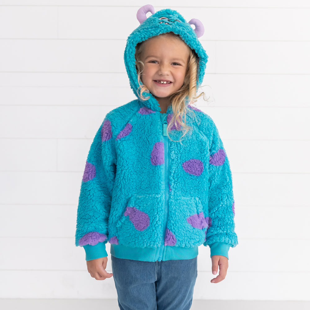 Smiling girl wearing the Disney Monsters, Inc. Sulley Sherpa Zip Hoodie