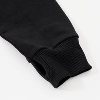Close up flat lay image of the thumb hole detail on the sleeve of the Black Zip Hoodie