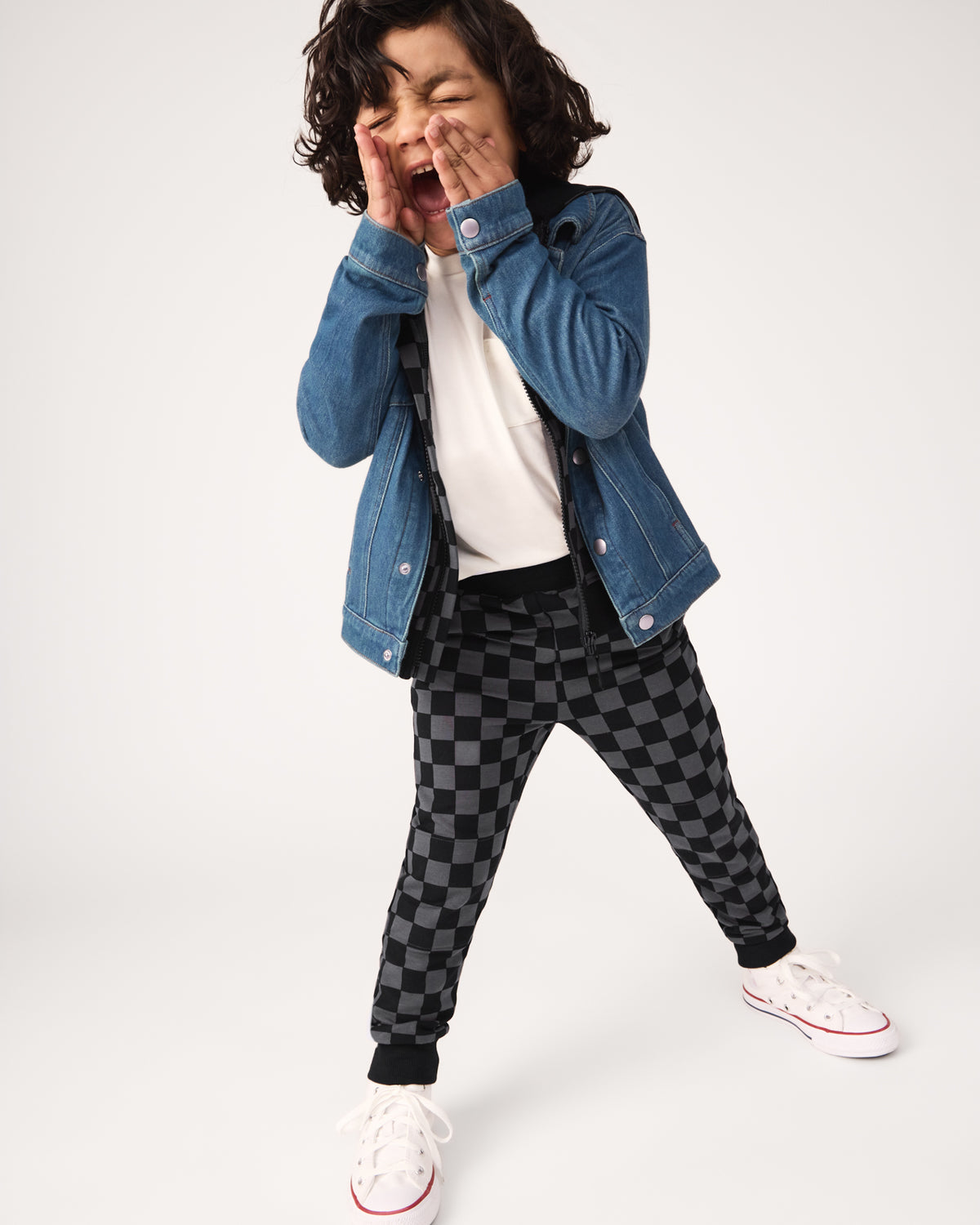Posing boy wearing the Monochrome Checks Jogger