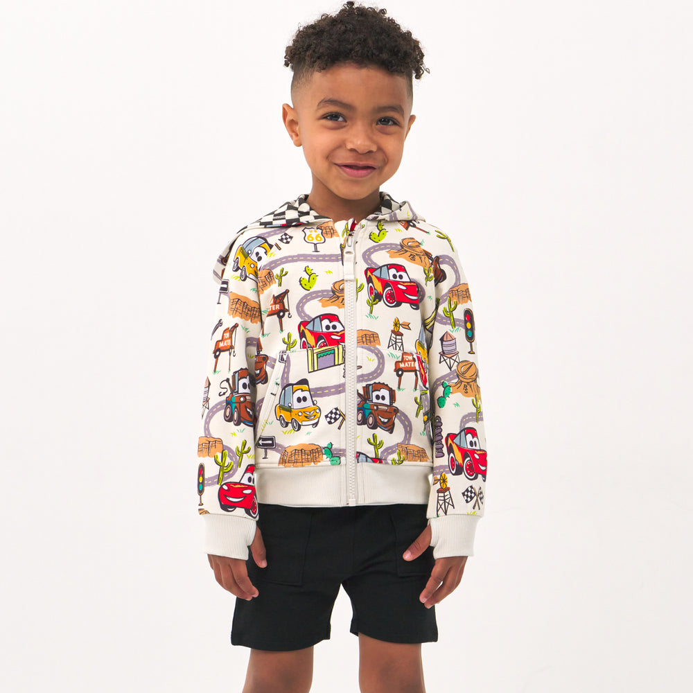 Alternate image of a child wearing a Radiator Springs zip hoodie with coordinating Play shorts