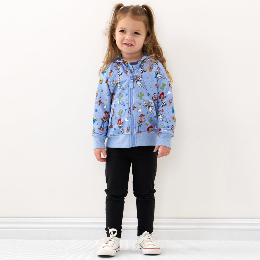 Click to see full screen - Child wearing a Disney Pixar Toy Story Pals zip hoodie and coordinating leggings