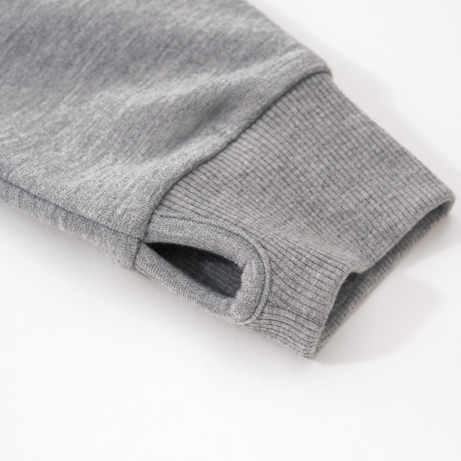 Close up image of the cuff detail on the Heather Gray Zip Hoodie