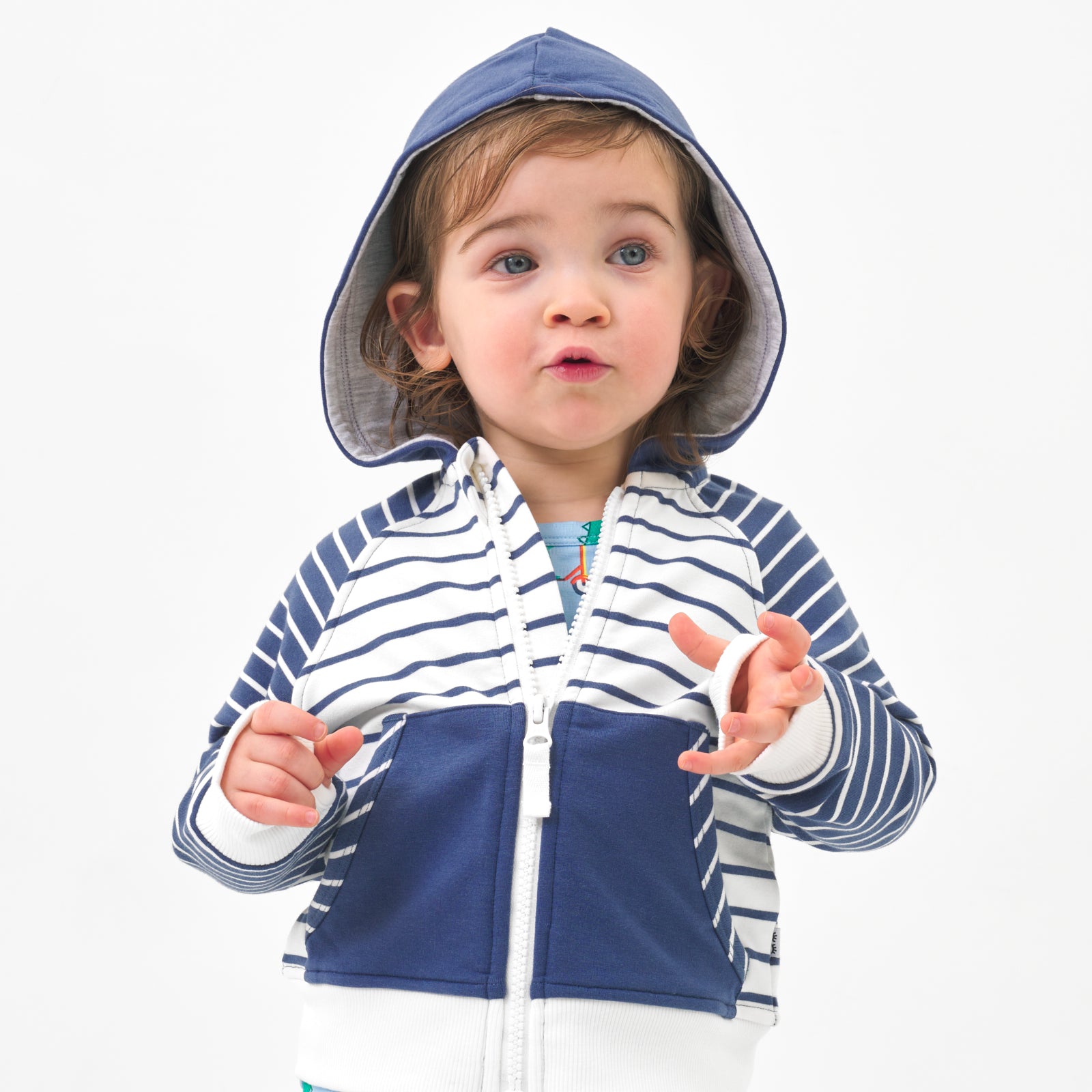 Close up image of a child wearing a Vintage Navy and Ivory Stripes zip hoodie 