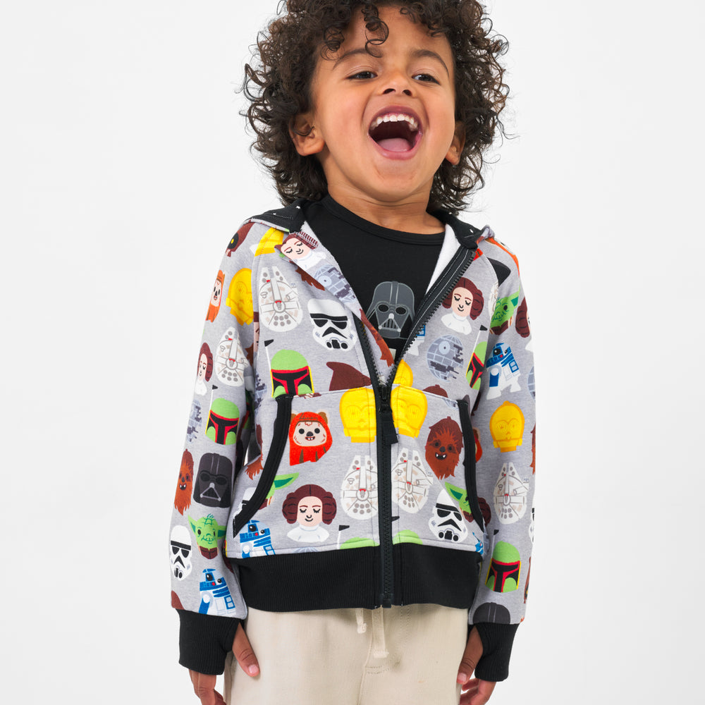 Child wearing a Legends of the Galaxy zip hoodie with coordinating Play top and bottoms