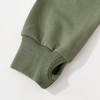 Close up image of the thumb hole cuff detail for the Moss Zip Hoodie