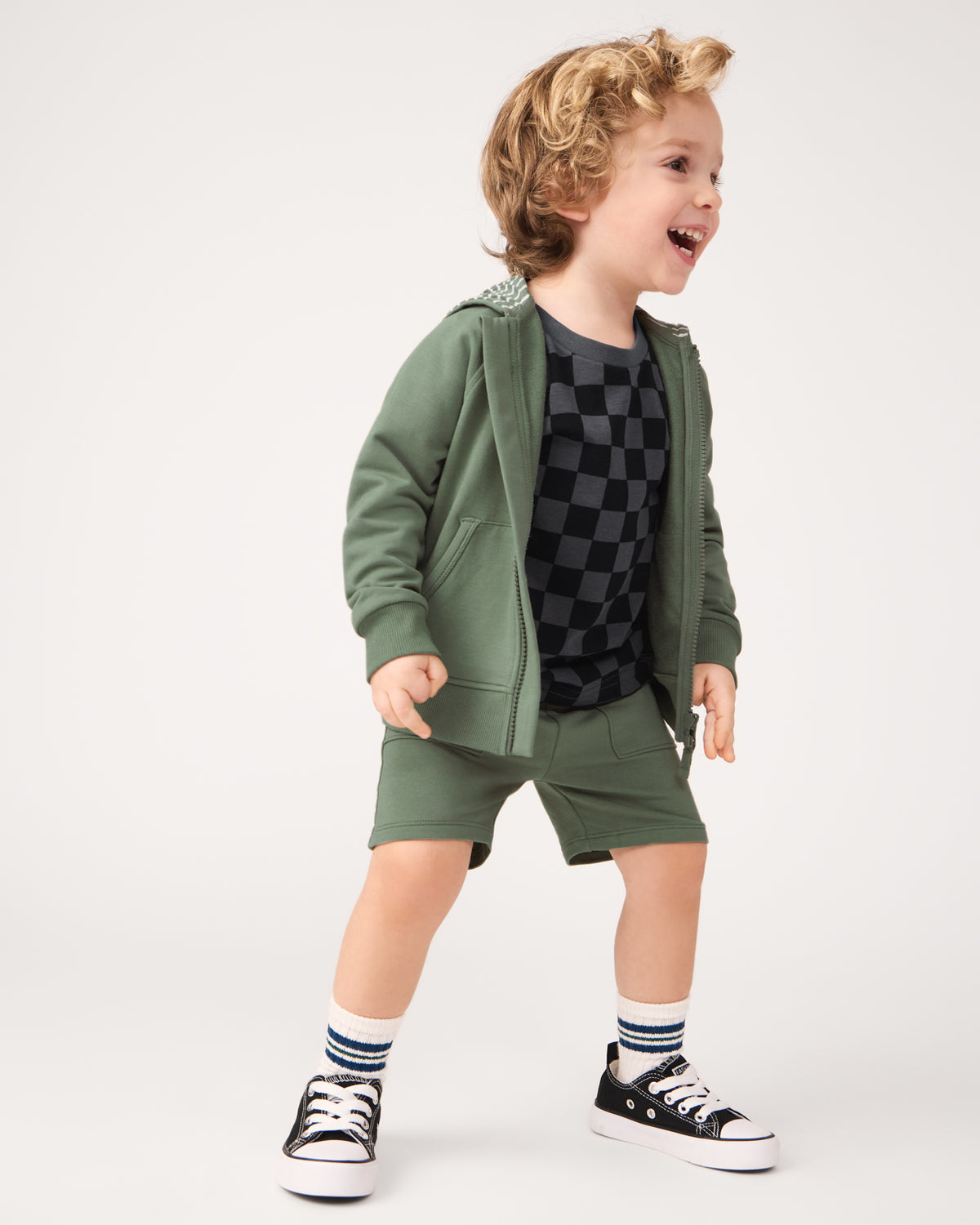 Boy wearing the Moss Zip Hoodie and Shorts set