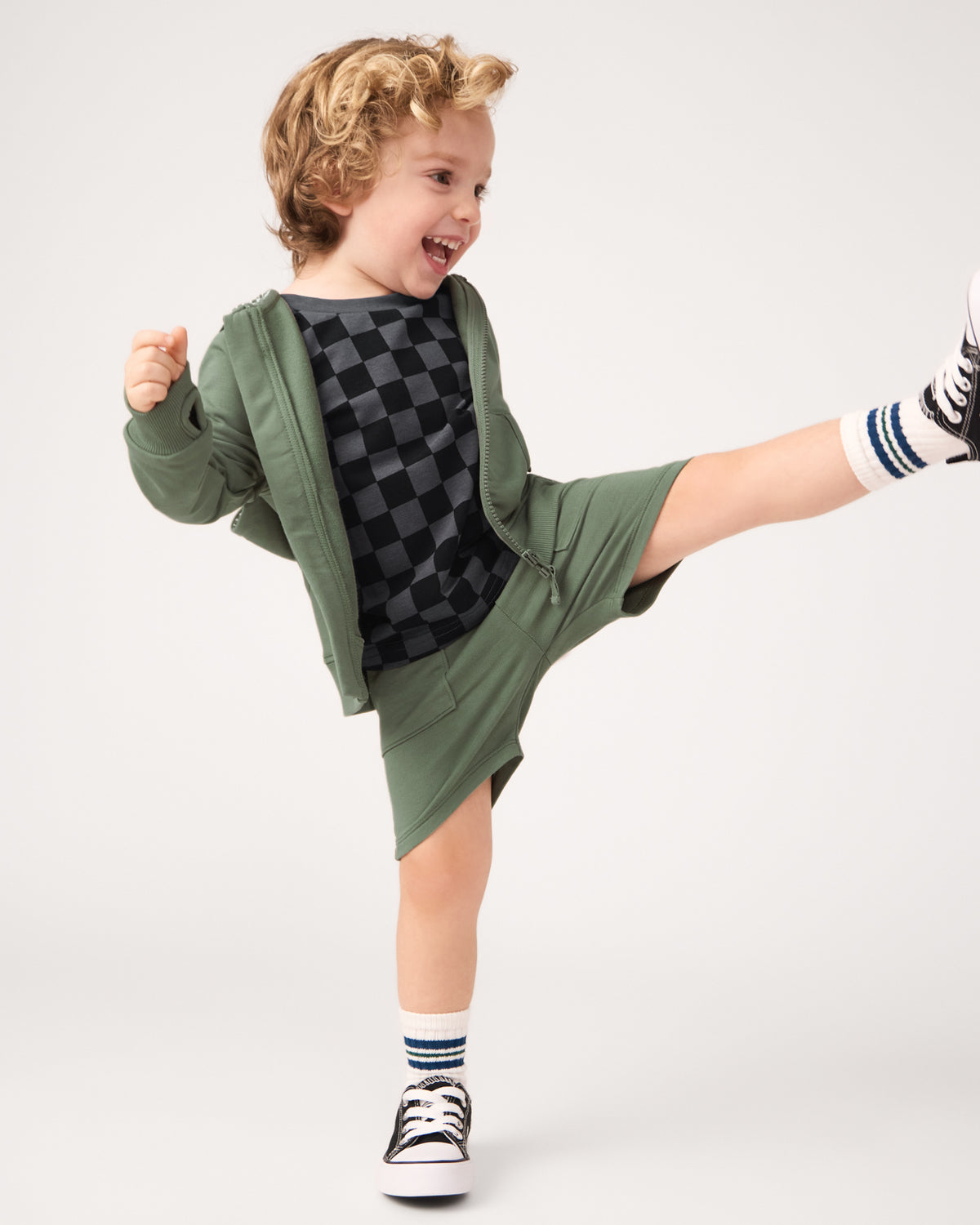Child in motion wearing the Moss Shorts
