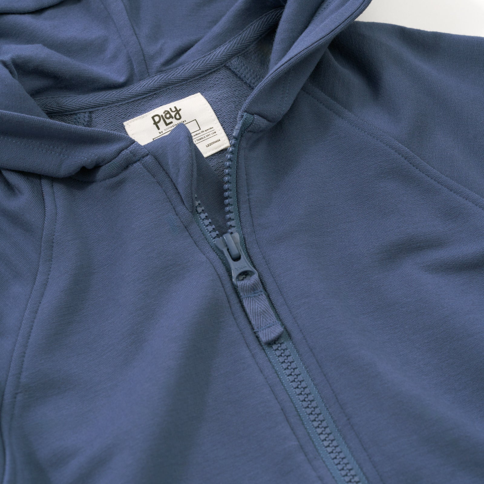 Close up image of the collar and zipper detail on the Vintage Navy Zip Hoodie