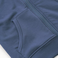 Close up flat lay image of the zipper and pocket detail on the Vintage Navy Zip Hoodie