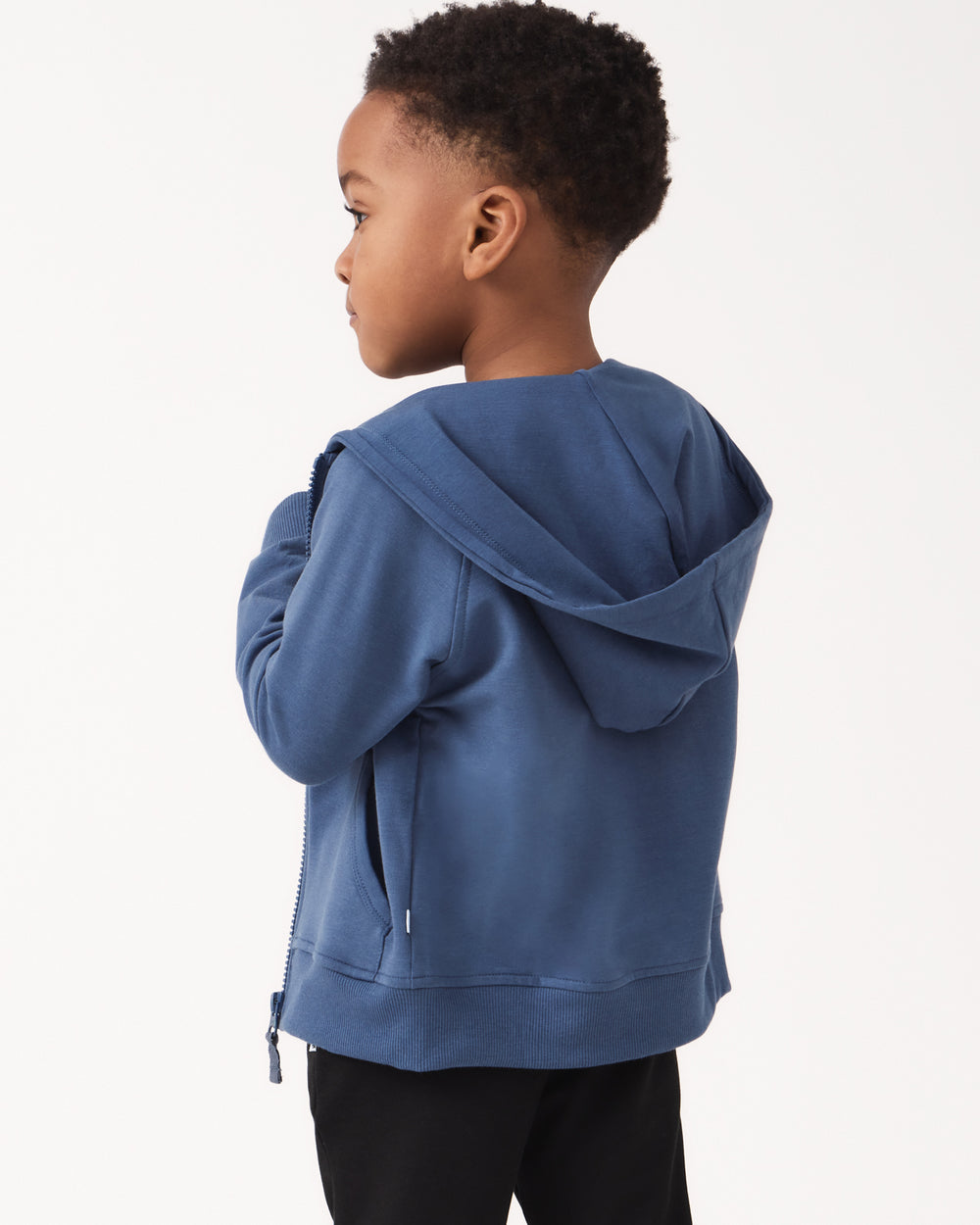Back view of boy wearing the Vintage Navy Zip Hoodie