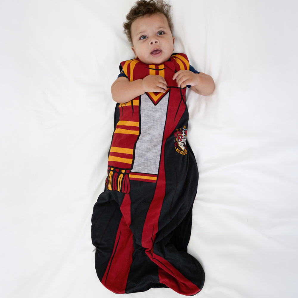 Alternate image of a child laying on a bed wearing a Harry Potter™ Gryffindor™ Robe Costume Sleepy Bag