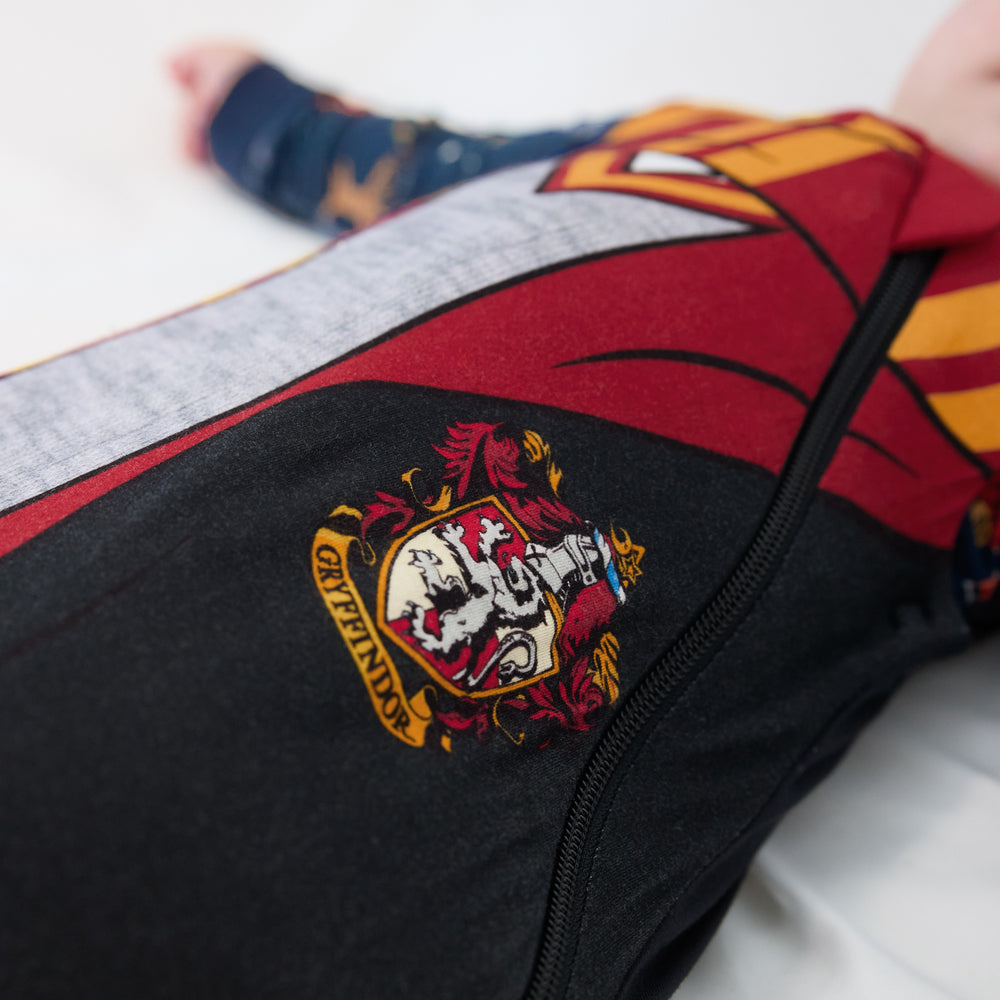 Close up detail shot showing the crest on a Harry Potter™ Gryffindor™ Robe Costume Sleepy Bag