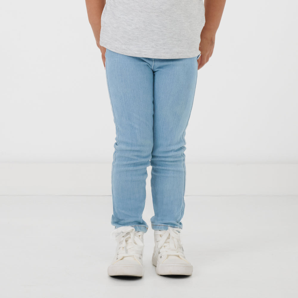 Close up of child wearing the Light Blue Denim Jegging