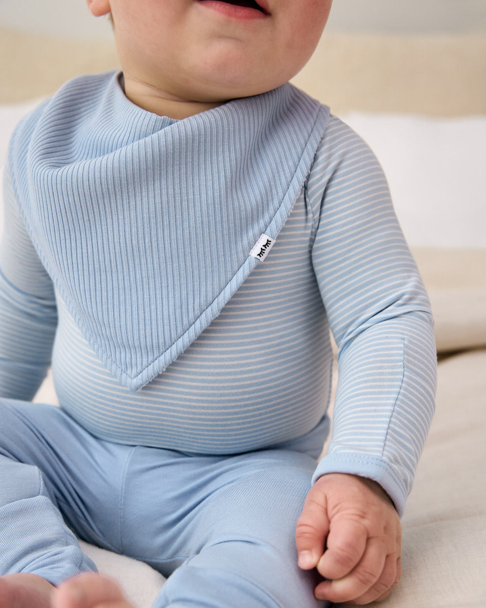 Close up of the Light Fog Ribbed Bandana Bib