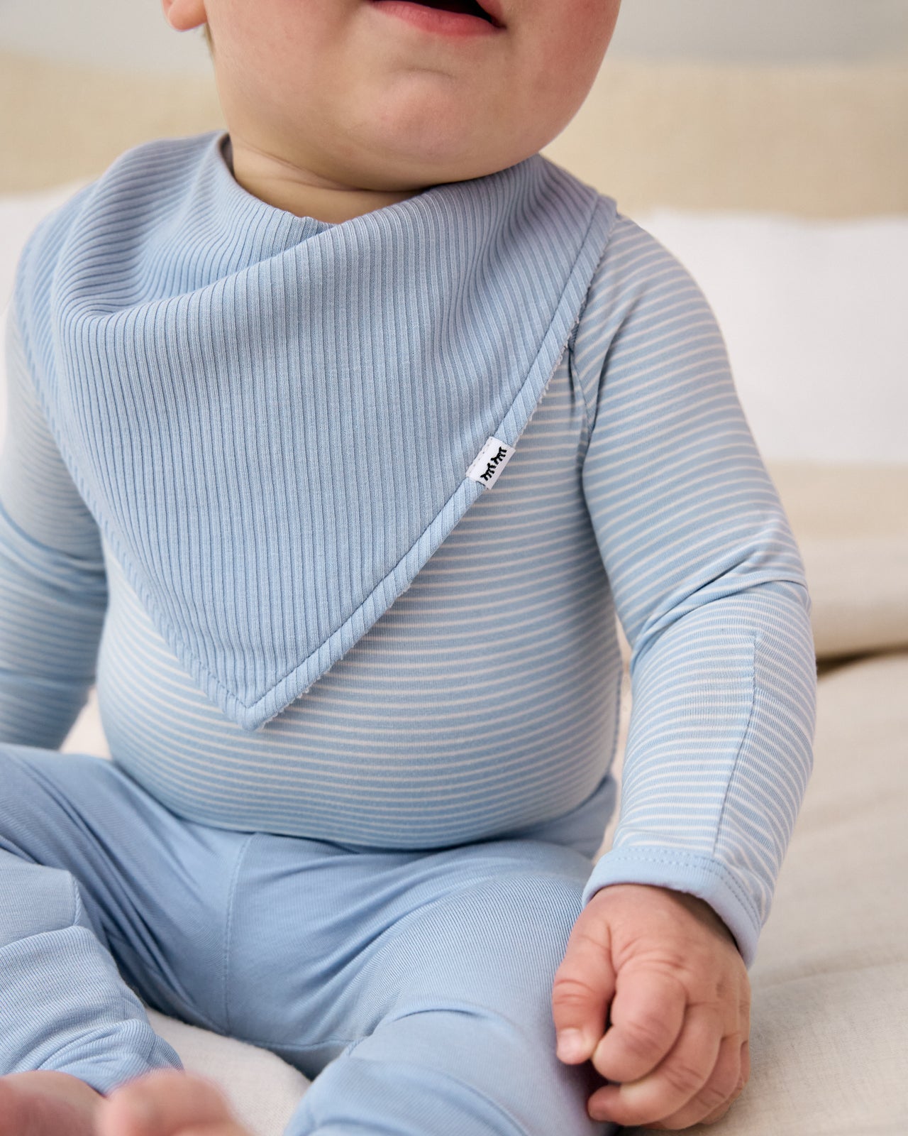 Close up of the Light Fog Ribbed Bandana Bib