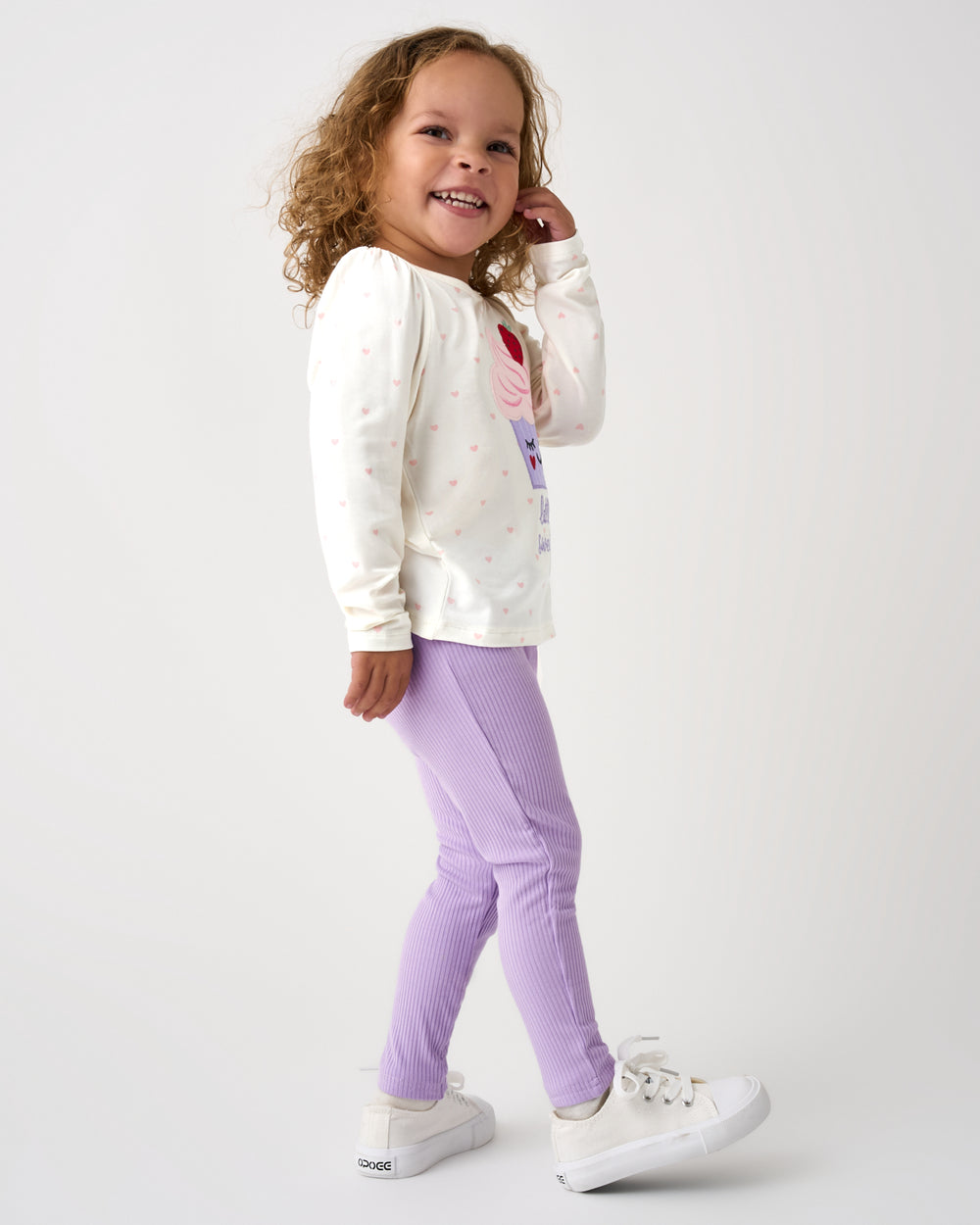 Side view of standing girl wearing the Lilac Haze Ribbed Legging