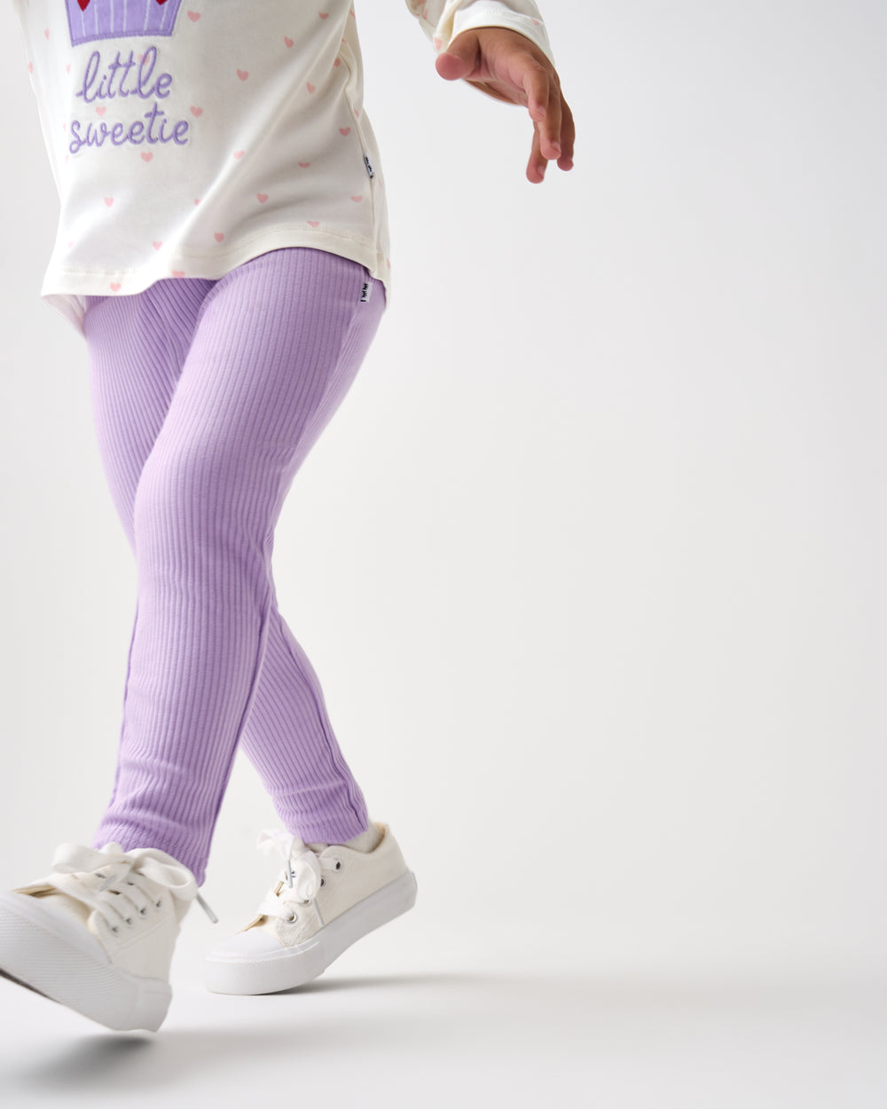 Running child wearing the Lilac Haze Ribbed Legging