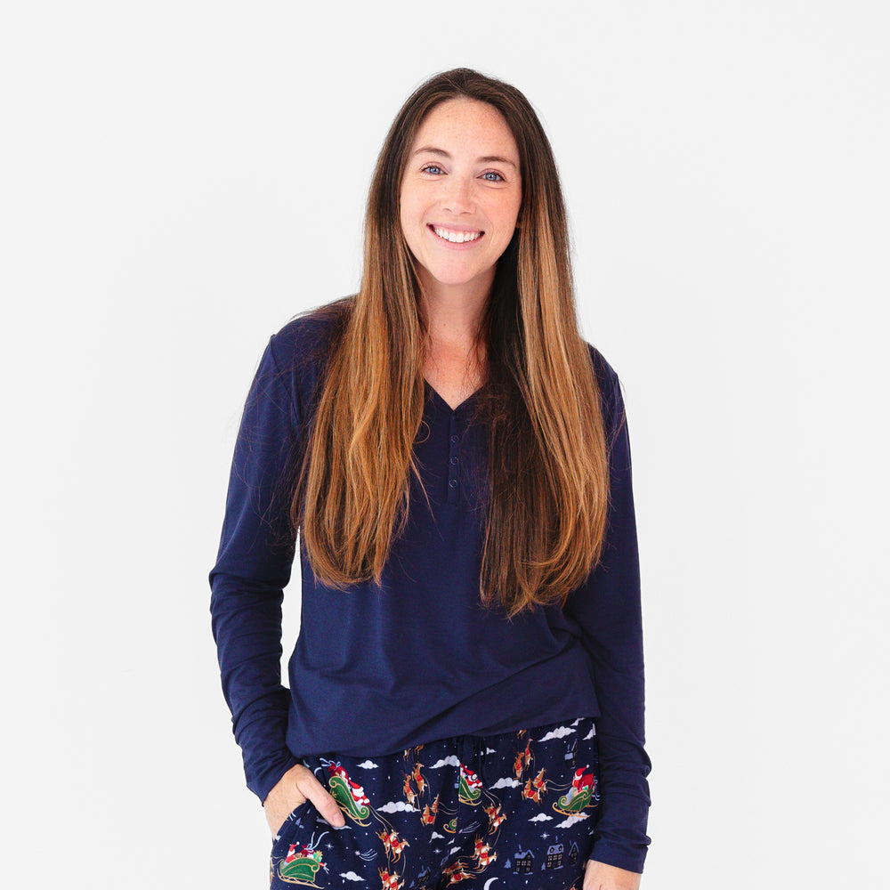 Close up image of female model smiling while wearing the Classic Navy Women's Pajama Top