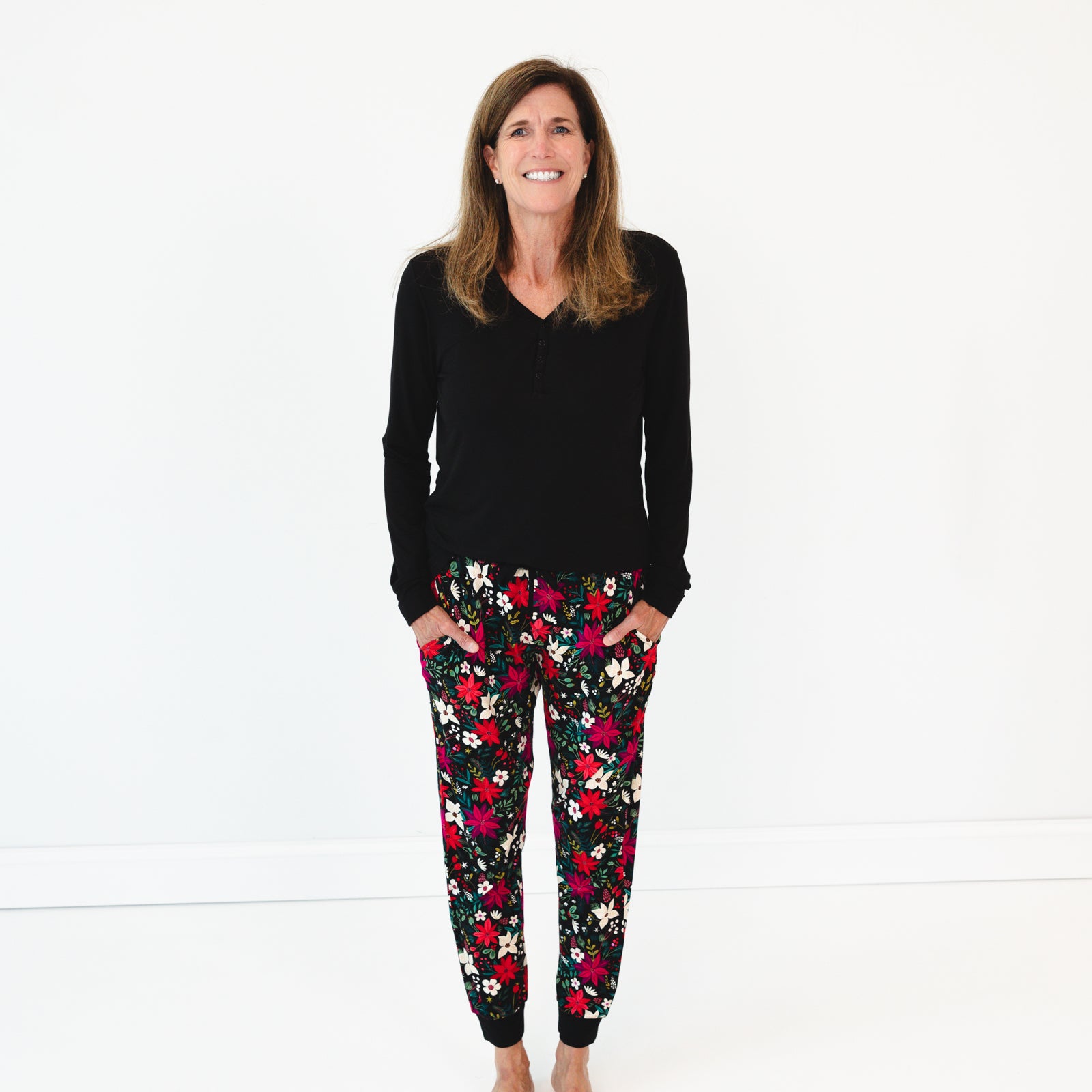 Female model wearing the Berry Merry Women's Pajama Pants and Black Long Sleeve Women's Pajama Top