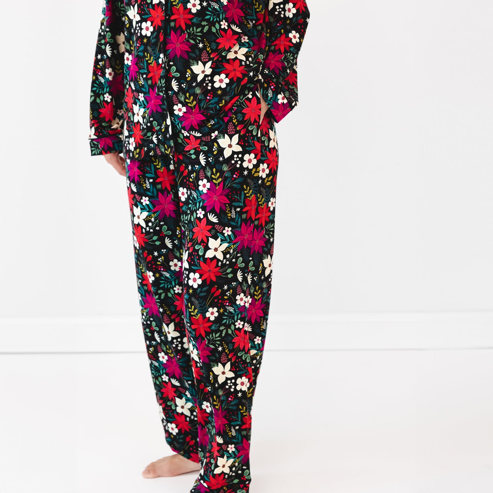 Close up image of female model wearing the bottoms of the Berry Merry Women's Long Sleeve Pajama Set