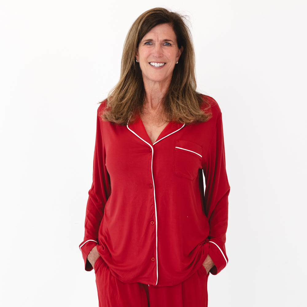 Close up image of smiling female model wearing the pajama stop included in the Holiday Red Women's Long Sleeve Pajama Set