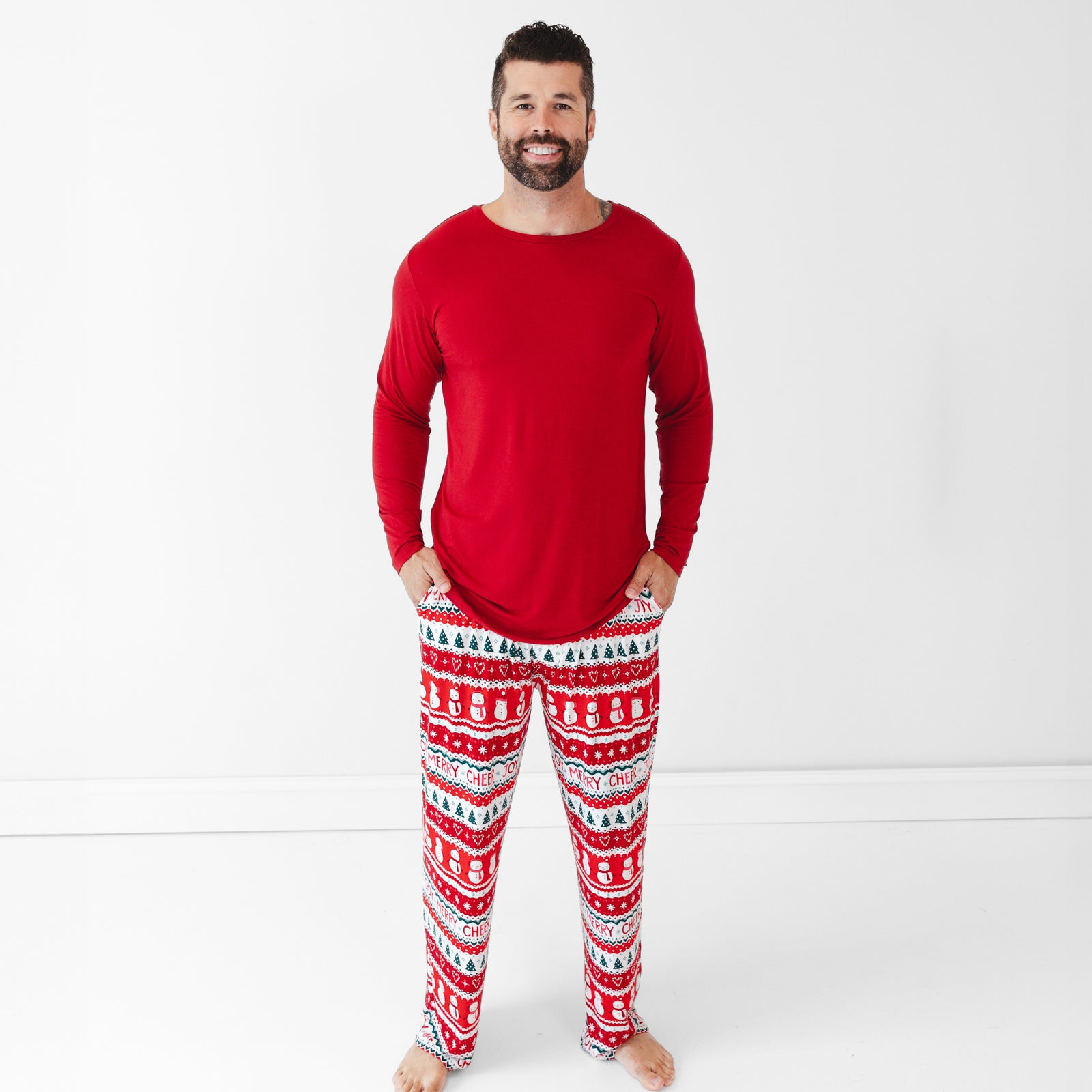 Man wearing Festive Fair Isle Men's Pajama Pants and Holiday Red Men's Pajama Top