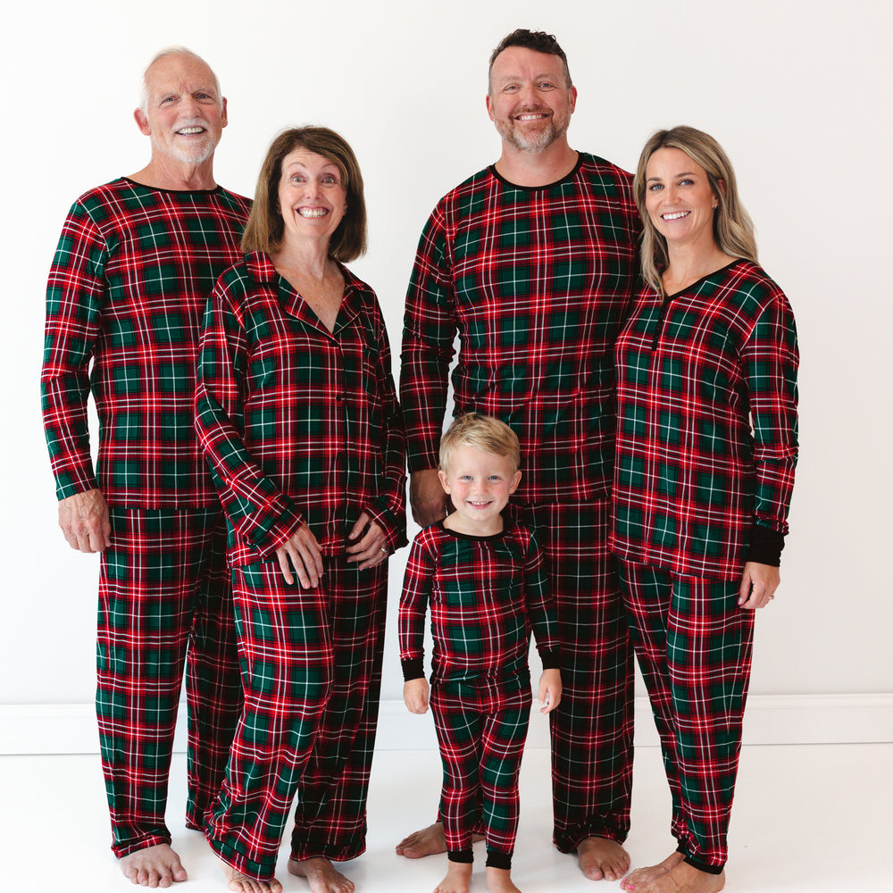 Family of five wearing matching Fireside Plaid pajamas