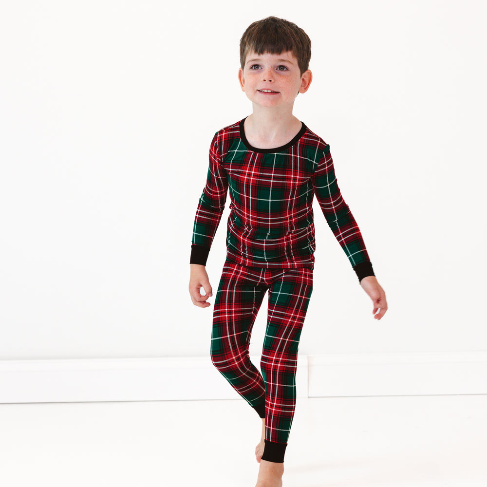 Child wearing a Fireside Plaid Two-Piece Pajama Set